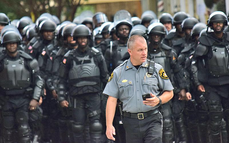 Lumpkin County Sheriff Stacy Jarrard keeps watch over the public square in Dahlonega amid hundreds of law-enforcement personnel at a political rally on September 14. (photo by Matt Aiken))