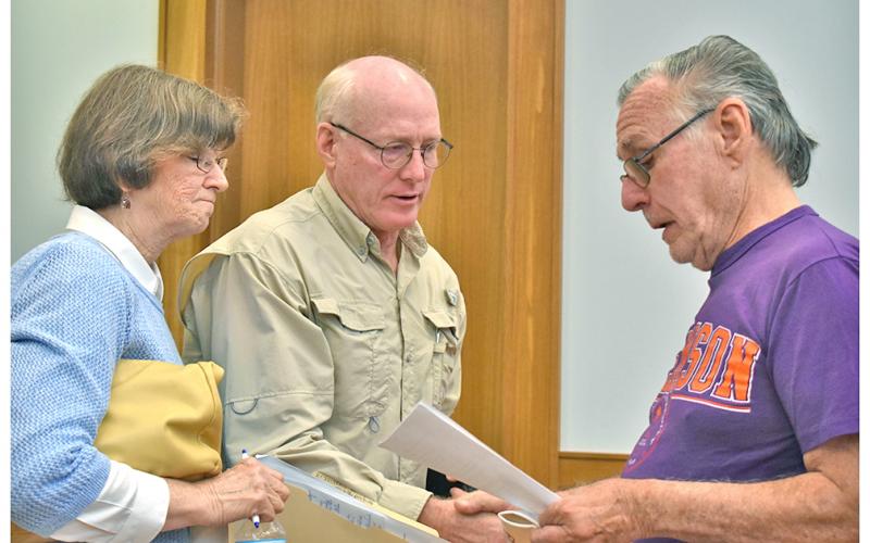 Dr. Laurel and Kurt Massey share a copy of a proposed resolution to declare Lumpkin County to be a “Sanctuary for Pre-born Life” with Byron Jeffries.