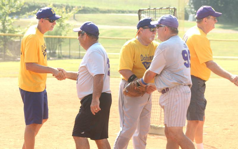 Members of the LC Miners and the Dahlonega Gold shake hands after the Miners defeated the Gold in the first round of the Clayton League Championship tournament last week.