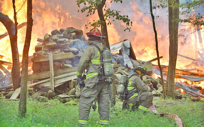 An old cabin off Camp Wahsega Road was brought to the ground in a matter of minutes after a suspected lightning strike hit the abandoned structure on Saturday. Firefighters from both Camp Frank D. Merrill and Lumpkin County Emergency Services responded to the scene.