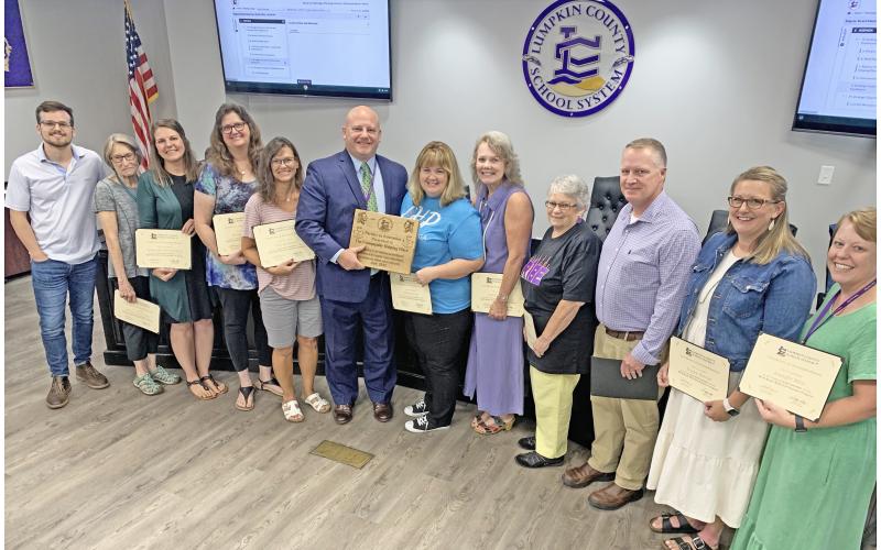 Lumpkin County School Superintendent Rob Brown and the members of the Board of Education recently honored the hard-working volunteers of the Well Read, Well Fed program including, from left, Chandler Girton, Shirley Christman, Samantha Fuerstenberg, Karen Shepherd, Debi Holloway, Brown, CHP Director Melissa Line, Lynn Sylvester, Mera Turner, James Forester, Tristen Parrish and Jennifer Moss.