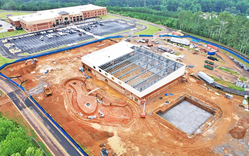 A drone photograph by Carroll Daniel Construction on August 11 shows an aerial view of the progress at the Pinetree Recreation Center site. Cottrell Elementary School is visible in the background.