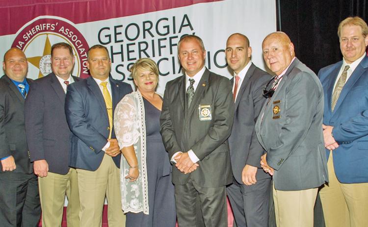 Attendees included, from left, Captain Marcus Sewell, Lieutenant Alan Roach, Captain Brendan Garland, Administrative Assistant to the Sheriff Rhonda Shepard, Sheriff Stacy Jarrard, Detention Division Staff Sergeant Noel Poisson, Chief Deputy Doug Cochran and Communications Director Carlton Chester. Senator Steve Gooch, Representative Kevin Tanner and Lumpkin County Coroner Jim Sheppard were on hand as well as Judge Michael Chastain led the swearing in ceremony.