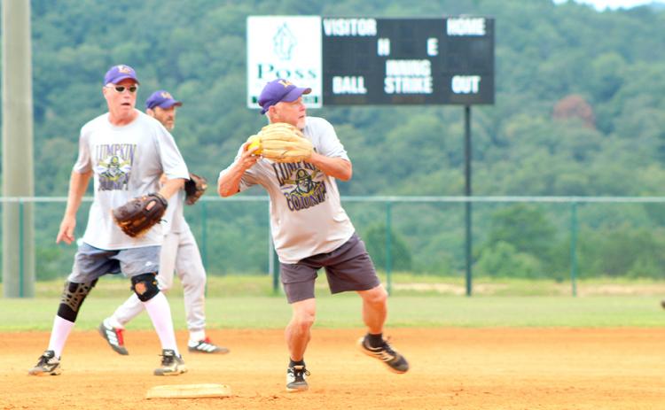Lumpkin shortstop Wayne "Got Em" Gaddis turns a double play during the Miners' matchup with the Gordy Scargle Division leading Hendersonville Sluggers.