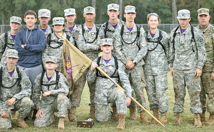 The Lumpkin County JROTC Raider team is pictured after the awards ceremony at the State Competition at Spalding High School. Pictured (from left) standing: Ashlyn Jewell, Mario Mendoza, Chase Cootware, Emily Martinez, Tatianna Lovell, Dane Sexton, Bailey Amey, Cody Gaddis, Madison Rodgers, Reece Butler and coach Jeff Moran. (Kneeling) Brigham Talton, Melia Matkovic and Levi Bennett.