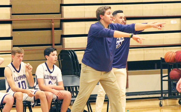 First-year middle school head boys basketball coach Daniel McCrary directs his players during their game against the Pickens County Dragons at the LCMS gym last week.