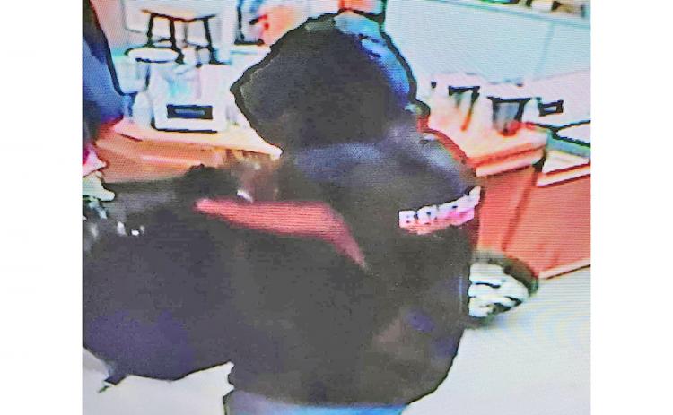 Surveillance footage captured an armed robbery at Crisson Gold Mine last week as the suspect entered the front store on Morrison Moore Parkway and made off with more than $100,000 in gold and jewelry.