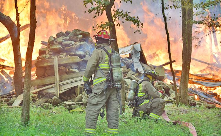 An old cabin off Camp Wahsega Road was brought to the ground in a matter of minutes after a suspected lightning strike hit the abandoned structure on Saturday. Firefighters from both Camp Frank D. Merrill and Lumpkin County Emergency Services responded to the scene.