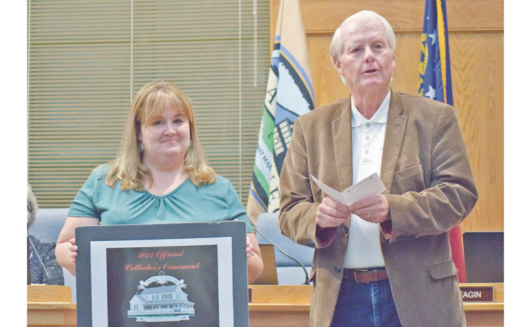 Community Helping Place Director Melissa Line stands alongside council member Ron Larson as the much anticipated CHP fundraising Christmas ornament was officially unveiled at last week's Dahlonega City Council meeting.
