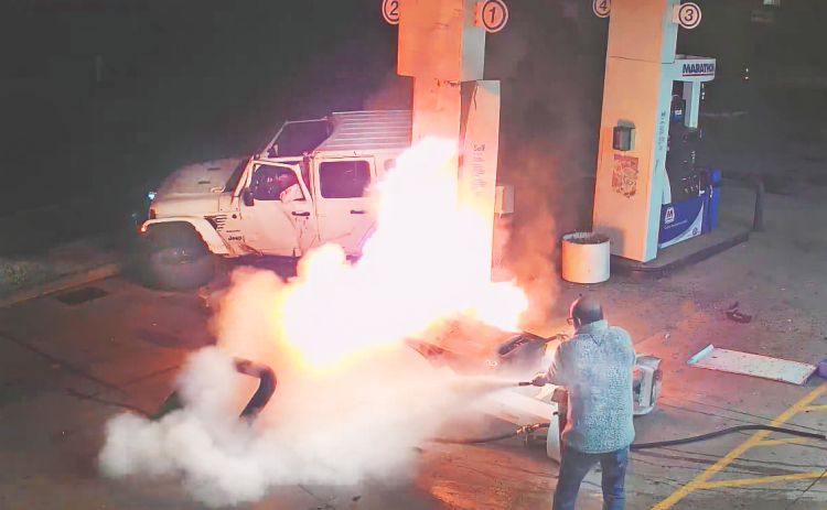 Security cameras captured the scene as Afzal Kutty battled a blaze that occurred last week at the local “Disco” Marathon gas station after a driver lost control and collided with the gas pump.