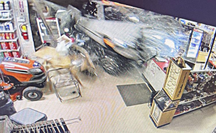 Surveillance video captured a pickup truck crashing through the front of Moores Hardware last week.