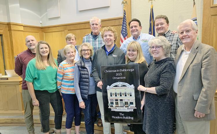 The much anticipated Community Helping Place fundraising ornament was unveiled at the Dahlonega City Council meeting earlier this month. This year's ornament features the golden facade of the Meaders Building. (Photo by Matt Aiken)