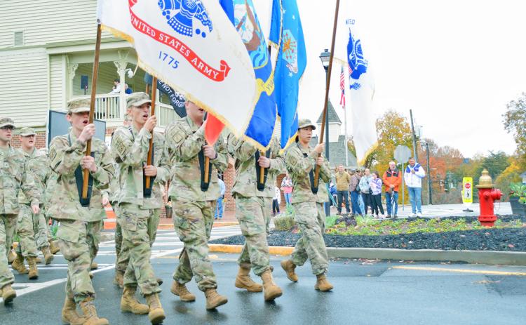 The Lumpkin County High School JROTC displays the flags during the Veterans Day Parade in Dahlonega.