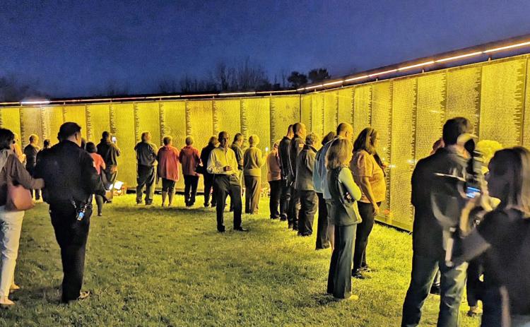 Evening visitors in Spartanburg, South Carolina view The Wall That Heals during a stop on the popular exhibit’s 2023 tour. The wall will visit Dahlonega at the end of October. (Submitted photo)