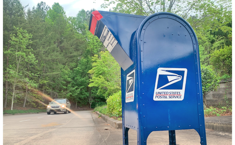 If you're shipping Dahlonega-to-Dahlonega mail it's best to avoid the big blue bin for now and hand your letter, package or parcel to an actual employee inside the post office.