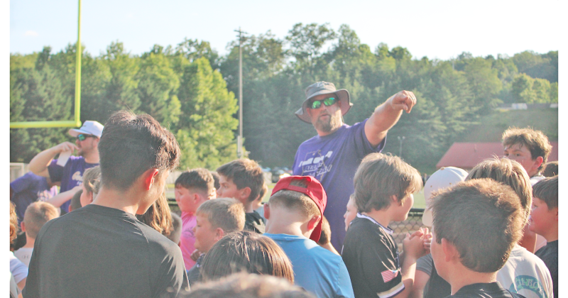 Assistant Coach Jake Estenson directs young participants during the recent summer camp.