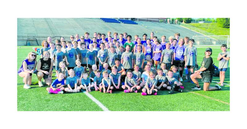 Lumpkin soccer campers, coaches and athletes gather for a celebratory group photo on the last day of camp.