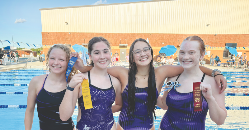 Pictured, from left, Ellie Moye, Abigail Herrit, Amelia Turk and Madison Barrick celebrate their finishes after facing off in a recent race.