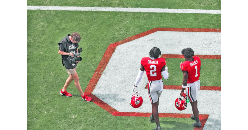 LCHS graduate Sam Edwards works the camera during a UGA game.