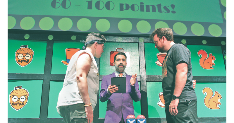 Contestants face off in a heated buzzer battle during Planet Acorn’s The Game Show Dahlonega.
