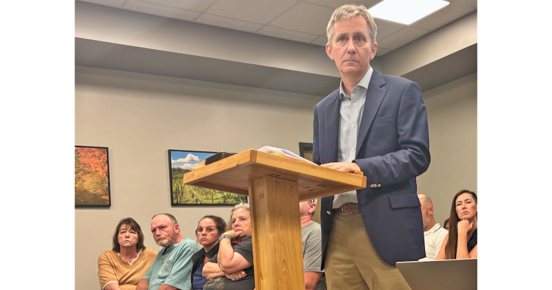 Patton Hahn stands at the podium during a packed Lumpkin County Planning Commission meeting last Monday.