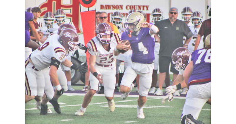 Junior quarterback Kolson Howell scrambles for extra yards against the Tigers during Friday night’s season opener.