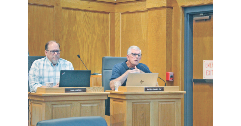 Dahlonega City Councilman Ross Shirley, seated to the right of Councilman Tony Owens, makes a motion to accept the presented fiscal budget under one condition.