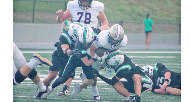 Alvarez fights for extra yards en route to his record-breaking performance of 318 rushing yards. 