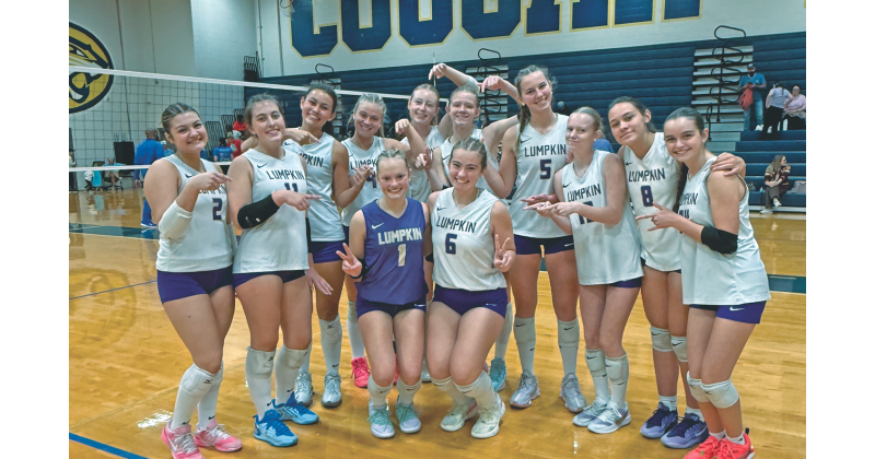 The Lumpkin volleyball team celebrates their big win over Crisp County in the first round of the State Playoffs.