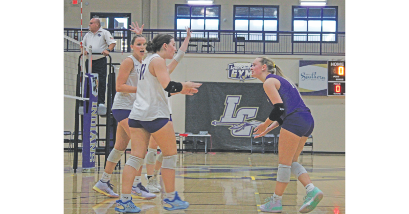 Trinity Henson (right), Hadley Glenn (center) and Emmie Kate Reese celebrate a score at a previous Lumpkin game.
