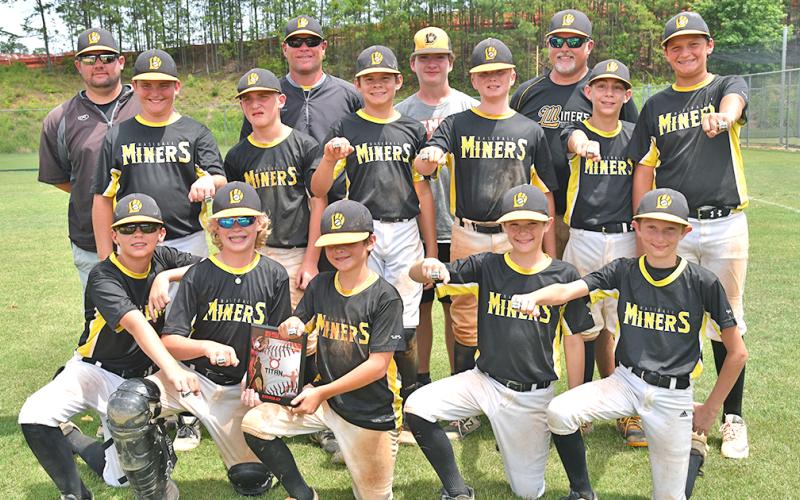 The Lumpkin Miners 12U baseball team shows off their runner-up rings from one of the tournaments they participated in during the 2019 spring season. The Miners went 26-14 during the three-month season.