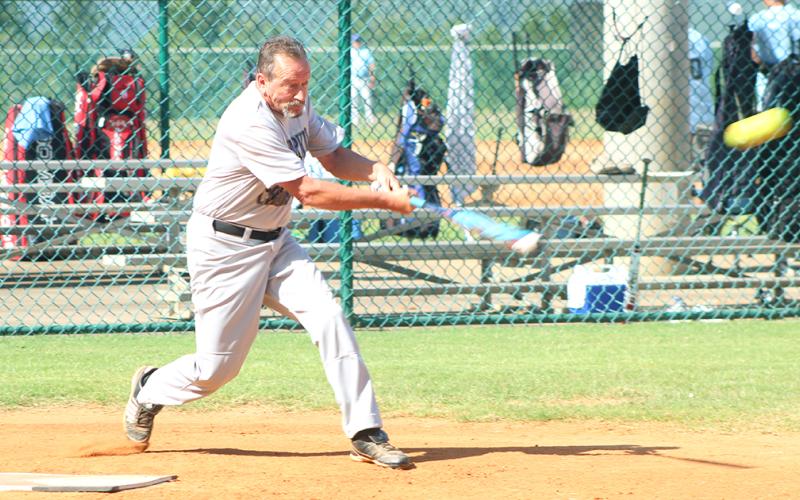 Miners player Jerome “Jackhammer” Kitchens connects for a RBI single in Lumpkin County’s game one win over the Franklin Old Bones last week. Kitchens went 5-for-7 during the Clayton League doubleheader.