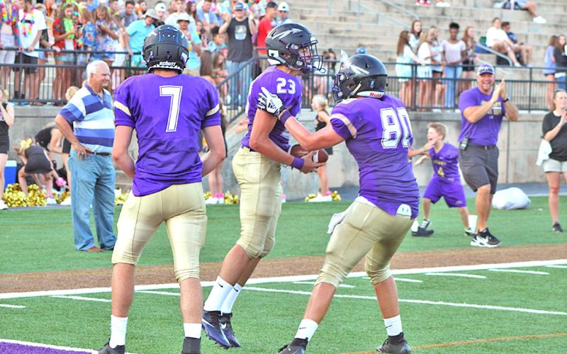 Lumpkin wide receiver Brian Cunane celebrates a touchdown reception during the Indians’ 41-7 scrimmage win over Towns County at the Burial Grounds at Cottrell Field on Friday night.
