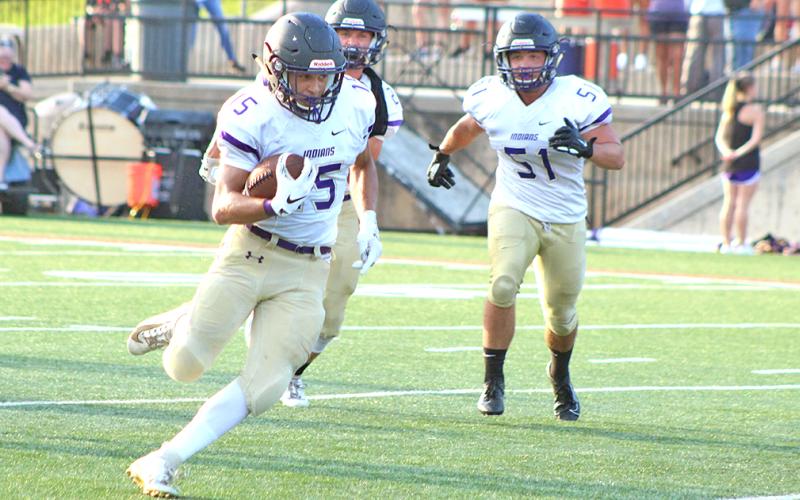 Lumpkin County High School wide receiver Trey Wilkes finds space in the secondary for some extra yards after pulling in a pass from LCHS quarterback Tucker Kirk.