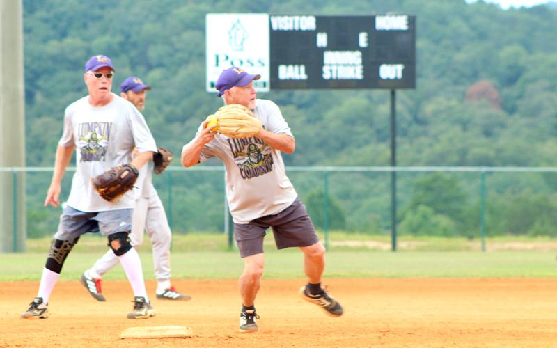 Lumpkin shortstop Wayne "Got Em" Gaddis turns a double play during the Miners' matchup with the Gordy Scargle Division leading Hendersonville Sluggers.
