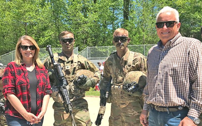 Jann Carl and Rodney Miller spend time with Army Rangers at Camp Frank D Merrill during filming earlier this year.