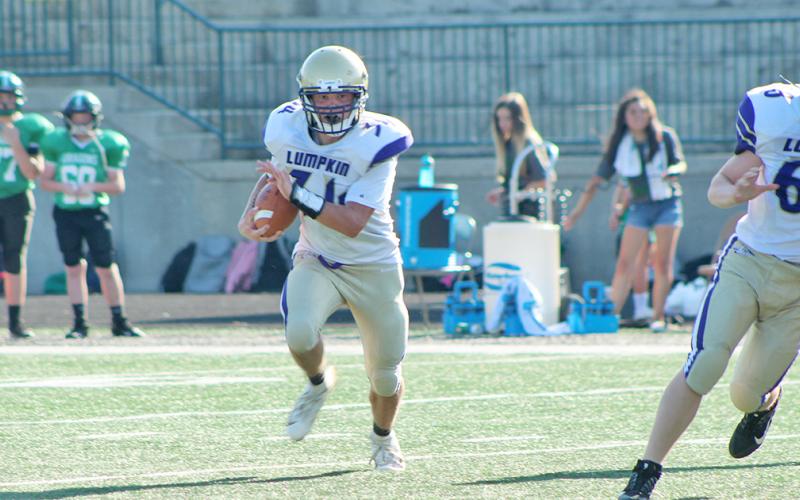 LCMS running back Will Wood looks for space after receiving a handoff. Wood scored two of the Indians’ three touchdowns in a 20-0 win over Fannin County last week.