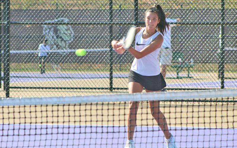Lumpkin’s Tru Koren returns service during the middle school tennis team’s match versus Tallulah Falls at the LCHS Tennis Complex last week.