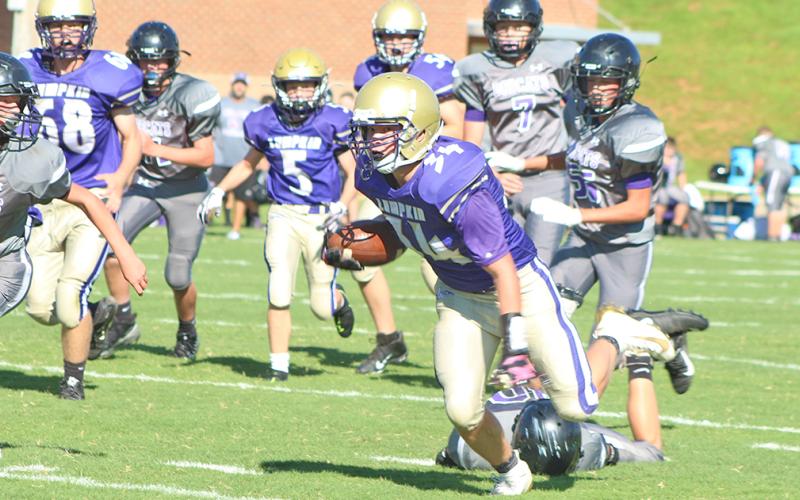 Running back Will Wood keeps his feet after avoiding a tackle on his way to one of his two touchdowns for the Indians.