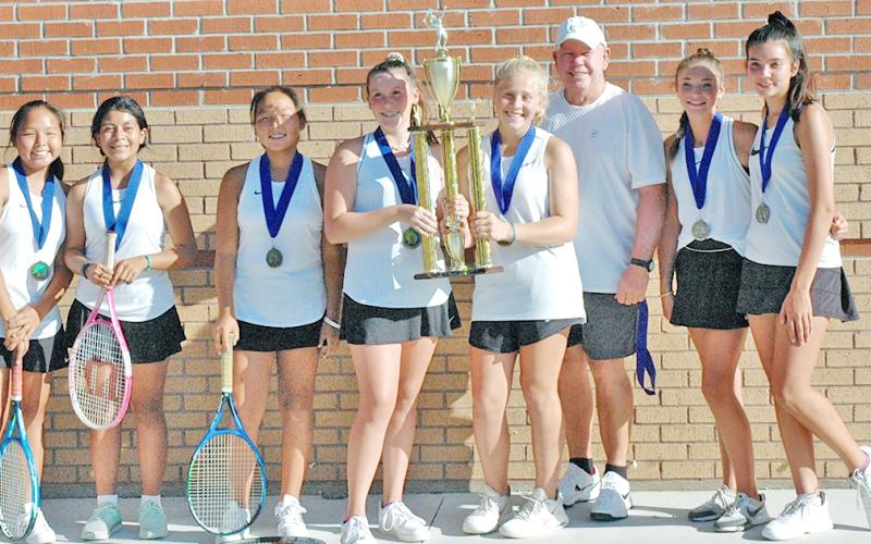 The Lumpkin County Middle School girls celebrate their win over Gilmer County in the Mountain League Championship last week. The championship title is the second straight for the team.