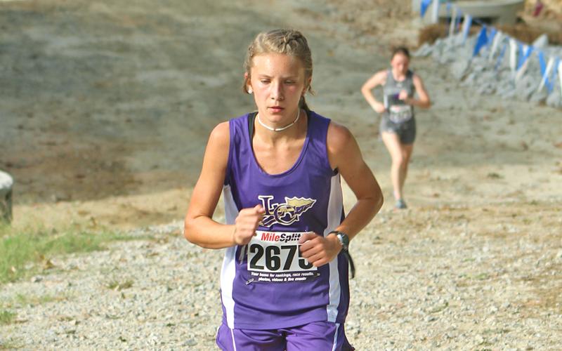 Abbie Hilchie navigates the final uphill portion of the course at the RMA Fall Runaway meet at Riverside Military Academy.