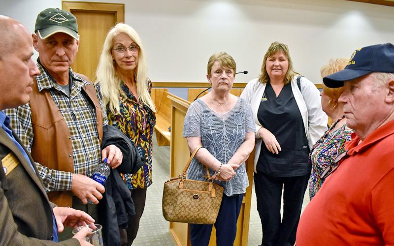 County Commissioner Jeffrey Moran talked with residents in the McDonald Mill subdivision after last week’s BOC meeting. They were there to voice their concerns about two short term rental properties in their neighborhood.