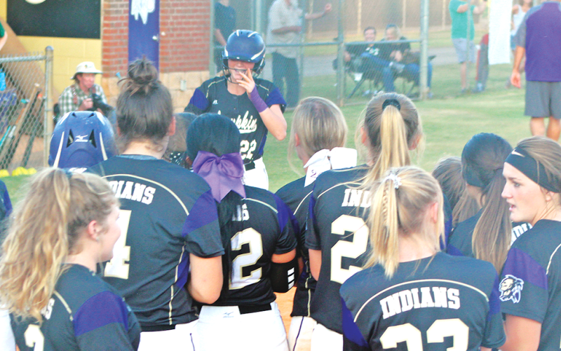 Lady Indian shortstop Evee Dornhecker is greeted by her teammates at home plate after she crushed a grand slam versus the North Hall Trojans last week.