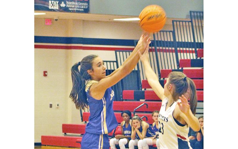 Lady Indians point guard Isabel Davenport goes up and drains a contested three-pointer against the Lady Panthers. Davenport knocked down 22 points in the Lumpkin victory.