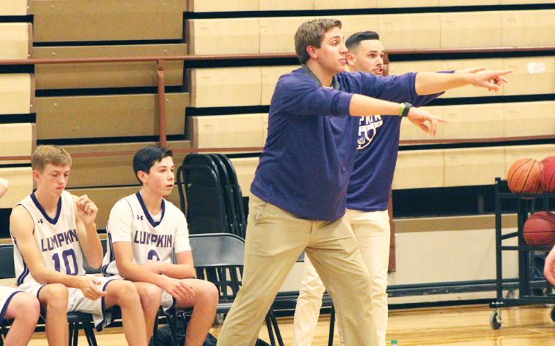 First-year middle school head boys basketball coach Daniel McCrary directs his players during their game against the Pickens County Dragons at the LCMS gym last week.