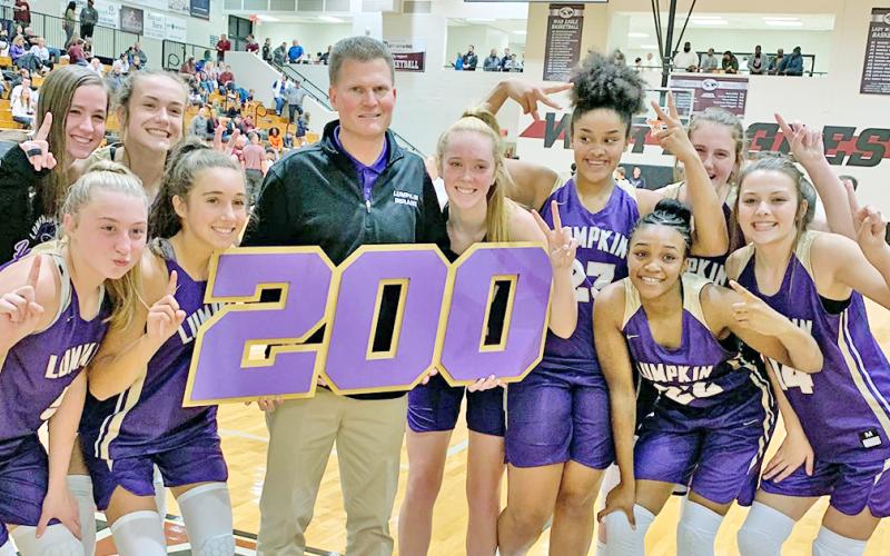 The Lady Indians celebrate LCHS head girls basketball coach David Dowse’s 200th career win after defeating the Chestatee Lady War Eagles in Lumpkin’s 2019-2020 season opener.