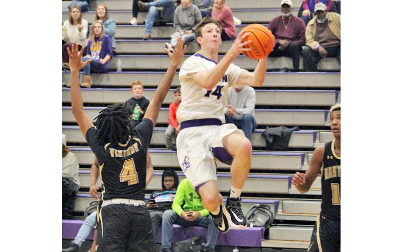 Standout Jacob Cumbie flies through the lane for two of his 17 points during Lumpkin’s region win over East Hall. Cumbie finished the game with a double-double, scoring 17 points and pulling down 10 rebounds.