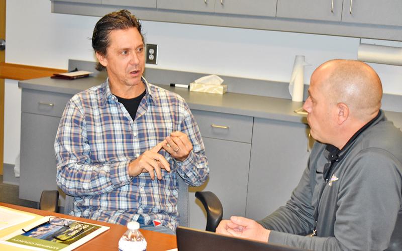 Developer Jack Hartrampf (left) speaks with Commissioner Jeff Moran during a break in one of two meetings on possible changes to the Gateway Corridor merely days before Lumpkin County commissioners were scheduled to vote on the new regulations. Hartrampf showed up at the public hearing on the Corridor to voice concerns.