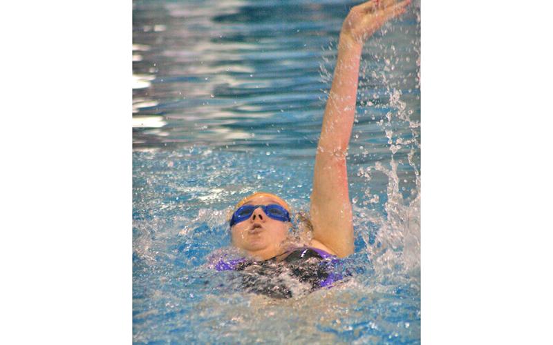 Lady Indians swimmer Faith Schofield takes part in the girls 100 yard backstroke event. Schofield had a successful day in the pool when the Lady Indians participated in the RMA Eagle Invite this past Saturday, Dec. 14.