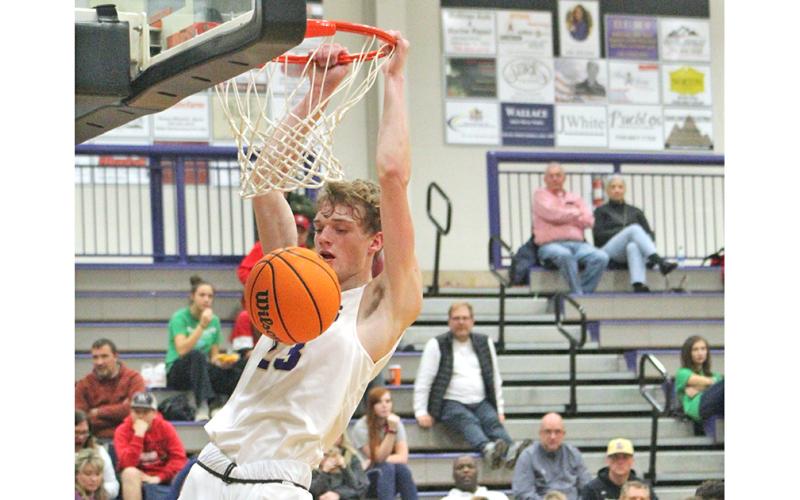Senior Peyton Polk throws down an emphatic dunk at the buzzer versus the White County Warriors at the Longhouse on Saturday, Jan. 18.